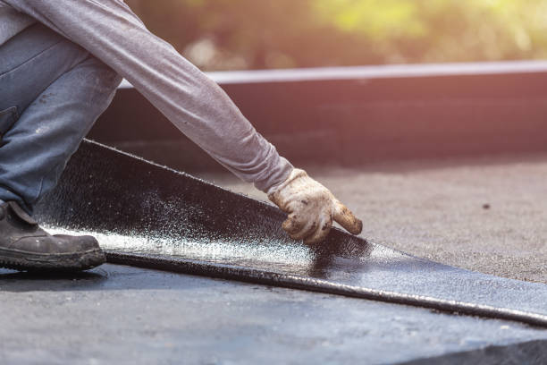 Professional Basement Waterproofing technician working in Yuba City, CA